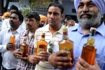 Indian devotees waits to offer liquor at the ‘Samadh’ in Punjab