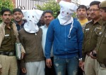 New Delhi: Police presents two people who were arrested in connection with the abduction and murder of the 13-year-old son of a jeweller before press in New Delhi, on Nov 25, 2014. Pratap Singh Sisodiya, 22 and Siddharth Sharma, 24 were arrested from east Delhi's Geeta Colony and Gandhi Nagar area, respectively. Utkarsh Verma, a Class 8 student, was abducted Nov 18 while returning from his school in Anand Vihar in east Delhi. His body was recovered near a drain on the outskirts of Delhi a day later. (Photo: IANS)
