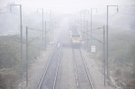 New Delhi: A number of trains get delayed as dense fog covers New Delhi. (Photo: Sandeep Datta/IANS)