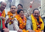 New Delhi: BJP leader Kiran Bedi with party leader Vijay Goel, Union Minister for Science & Technology and Earth Sciences Dr. Harsh Vardhan and others proceeds to file her nomination papers for upcoming Delhi assembly polls at Krishna Nagar, Delhi on Jan 21, 2015. (Photo: Sunil Majumdar/IANS)