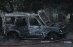 New Delhi: A charred vehicle seen after a clash between AAP and BJP workers following a debate show on a Hindi television channel in Tughlakabad area of south Delhi on Jan. 3, 2015. (Photo: IANS)