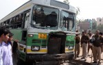 New Delhi: A bus that was damaged by an irate mob after a child was run over by a bus on Mehrauli Badarpur Road near Ambedkar Nagar, New Delhi on March 13, 2015. (Photo: IANS)